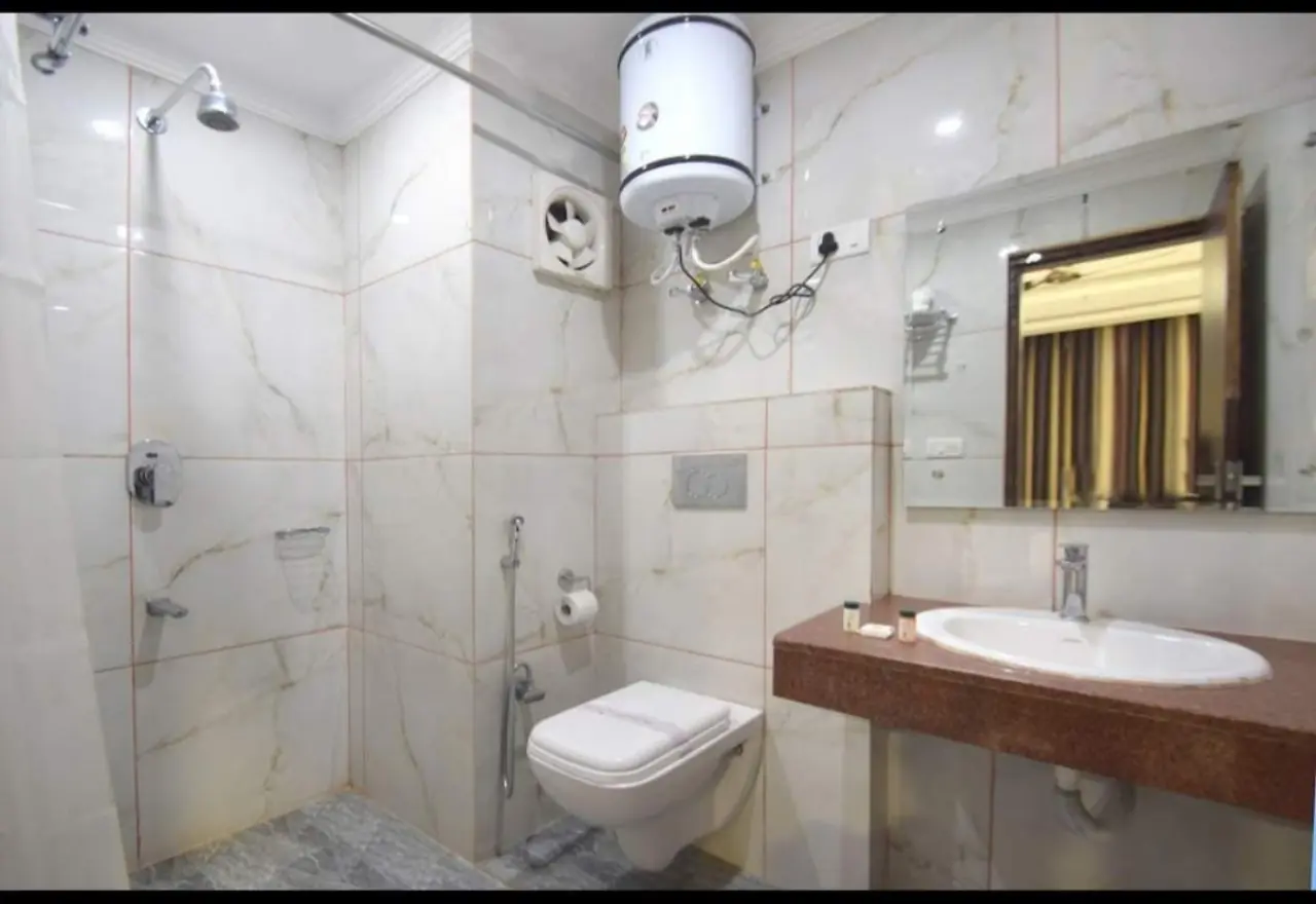Marble bathroom with rain shower area