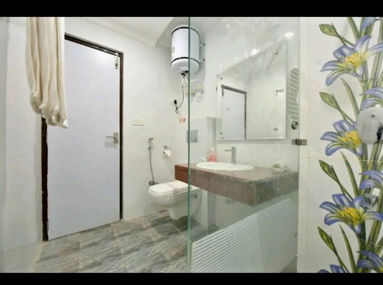 Bathroom with shower and toilet in Triple Room