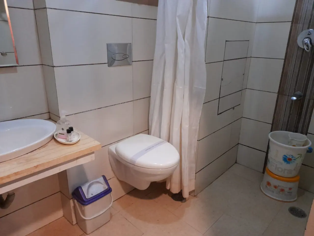 Bathroom with shower curtain and sink