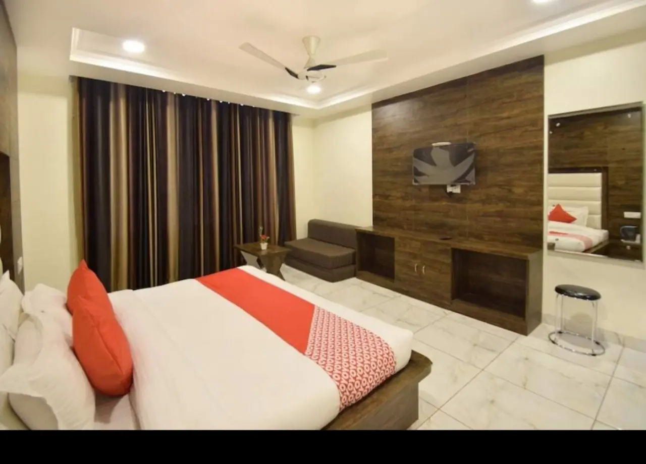 Double room with TV unit and seating at Hotel Galaxy Katra