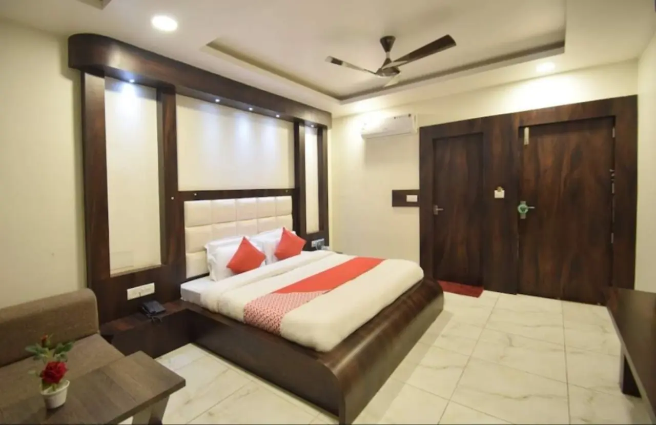 Triple room with dark wood decor at Hotel Galaxy Katra